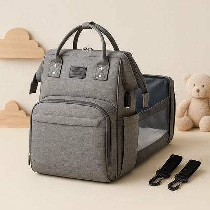Baby Essentials-4 baby diaper bag with USB port and sleeping crib, showcasing a stylish, functional diaper bag in a studio shot.