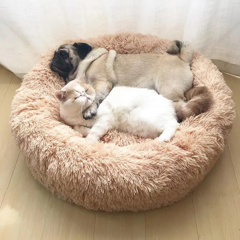 Soft Pet Essentials-11 Calming Donut Bed for dogs and cats with plush, circular design and raised edges for comfort.