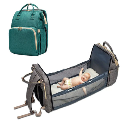 Baby Essentials-4 baby diaper bag with USB charging port and built-in sleeping crib, shown with multiple compartments and stylish design.