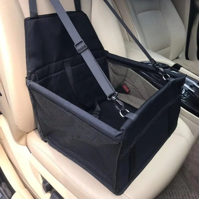 Dog travel car seat carrier by Pet Essentials-11 showing a cozy seat with safety straps and mesh sides for ventilation.