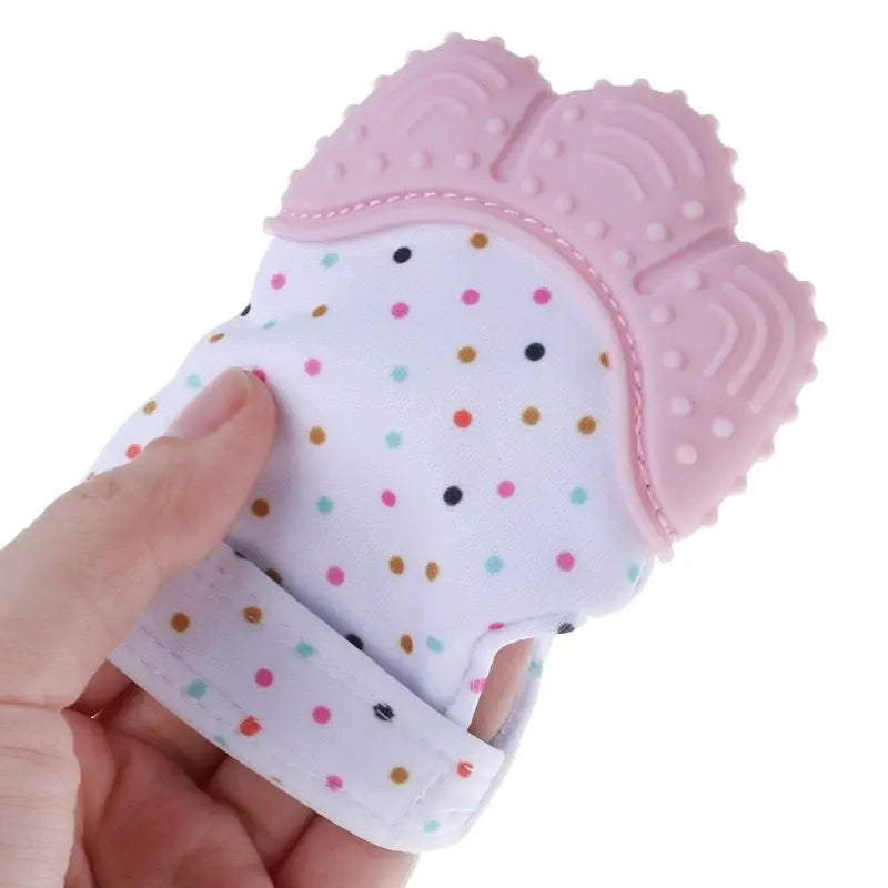 Baby Essentials-4 teething glove with textured mitten design, soft fabric, and soothing toy for calming babies during teething.
