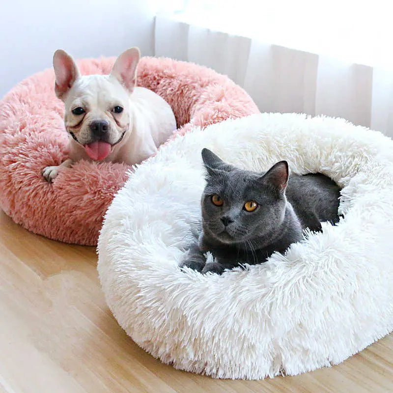 Pet Essentials-11 calming donut bed for dogs and cats with soft, plush fabric and raised edges for comfort and relaxation.