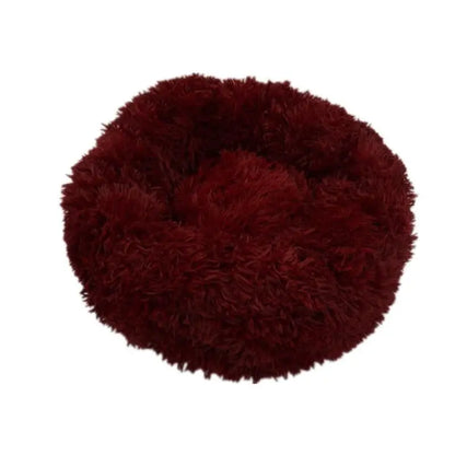 Soft, round Pet Essentials-11 Calming Donut Bed for dogs and cats, with plush fabric and cozy design for restful sleep.