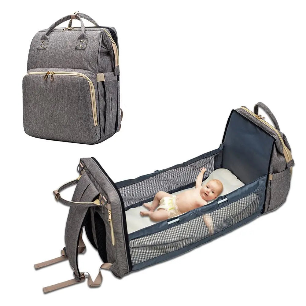 Baby Essentials-4 baby diaper bag with USB charging port and built-in sleeping crib, featuring multiple compartments and comfortable straps.