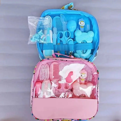 Set of 13 Zenn Organics Inc baby care tools including hair wash brush, nail clippers, nasal aspirator, comb, and newborn care essentials.
