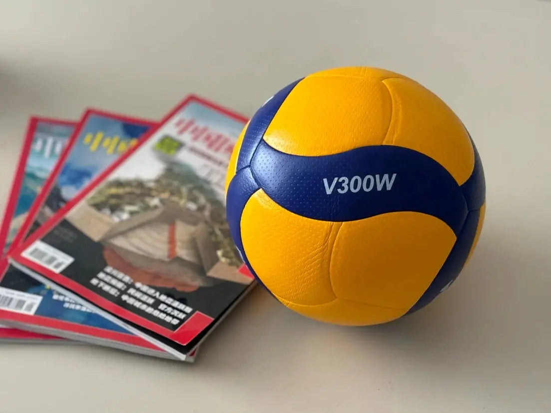 Zenn Organics Inc Original V200W V300W size 5 competition game volleyball on a court with a net in the background