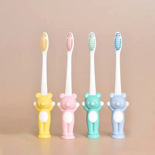 Set of four Little Bear suction cup children's toothbrushes by Zenn Organics Inc with colorful handles for easy gripping.