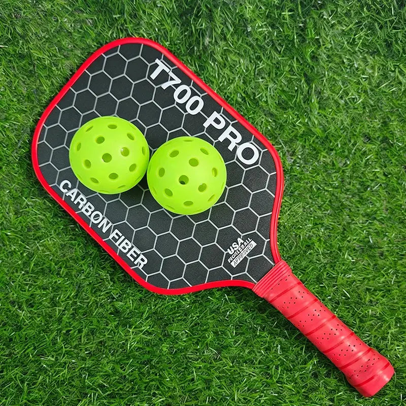 Zenn Organics T700 pickleball paddle with carbon fiber surface and 16mm polypropylene honeycomb core, shown on a neutral background.