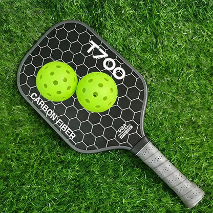 Zenn Organics Inc LEATOU T700 pickleball paddle with carbon fiber surface and 16mm polypropylene honeycomb core, shown on a neutral background.