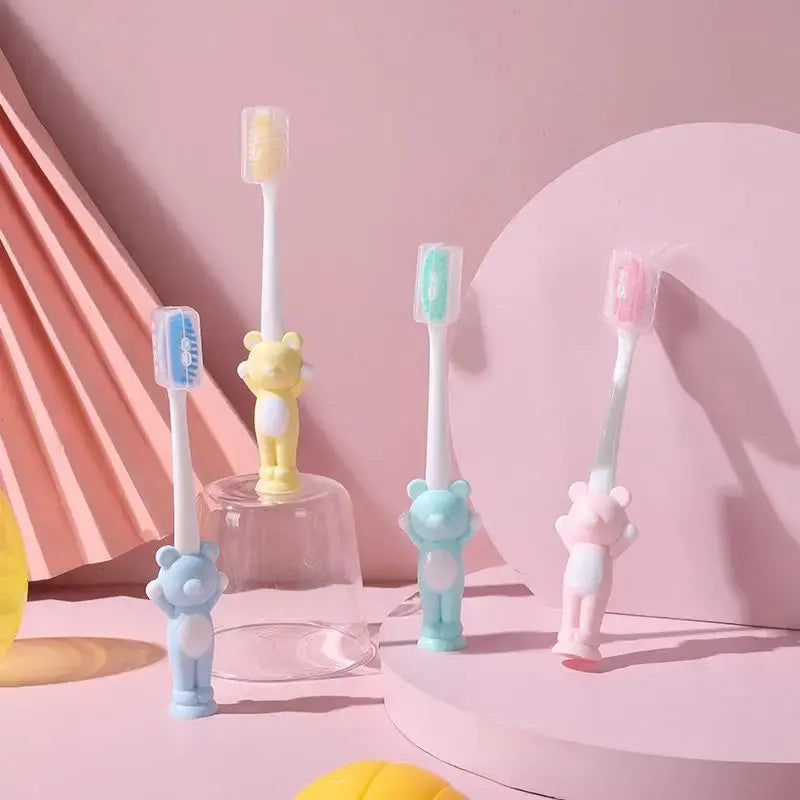 Set of four Little Bear suction cup children's toothbrushes by Zenn Organics Inc, featuring colorful designs for fun baby brushing.