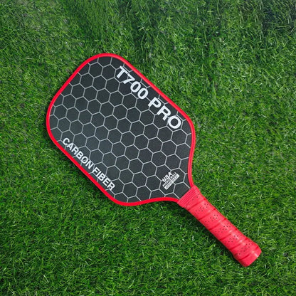 Zenn Organics T700 Carbon Pickleball Paddle with black and white design and ergonomic handle, ready for game play