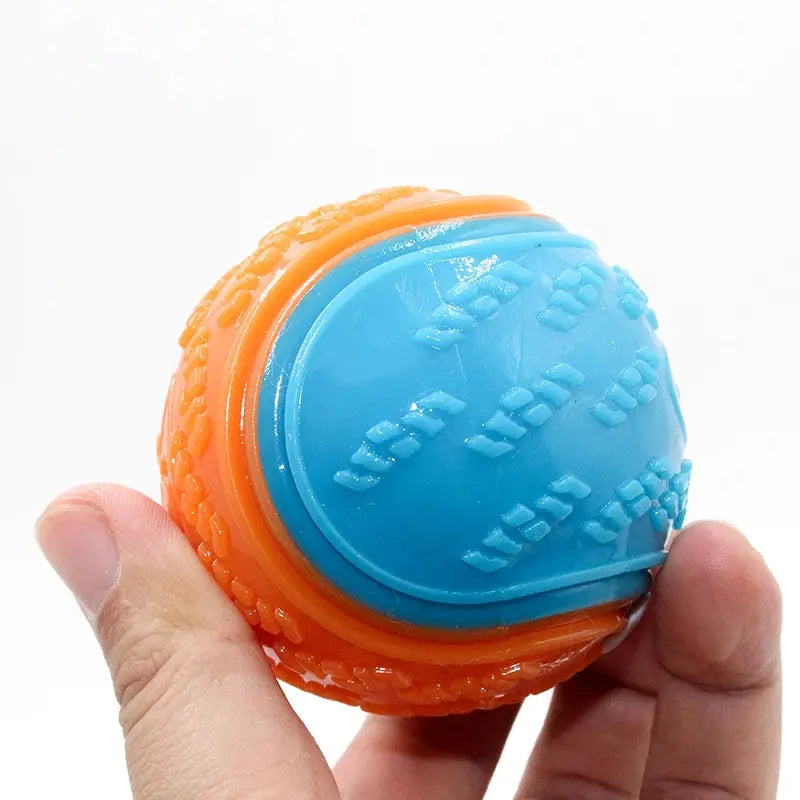 Soft TPR dog toy ball from Zenn Organics Inc, designed for interactive play, teeth cleaning, and squeaky fun for pets.