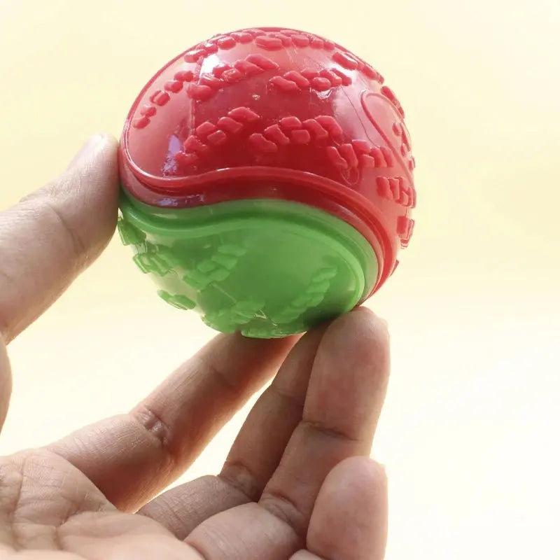 Interactive dog toy by Zenn Organics Inc, soft TPR squeaky ball for pet teeth cleaning and bite resistance.