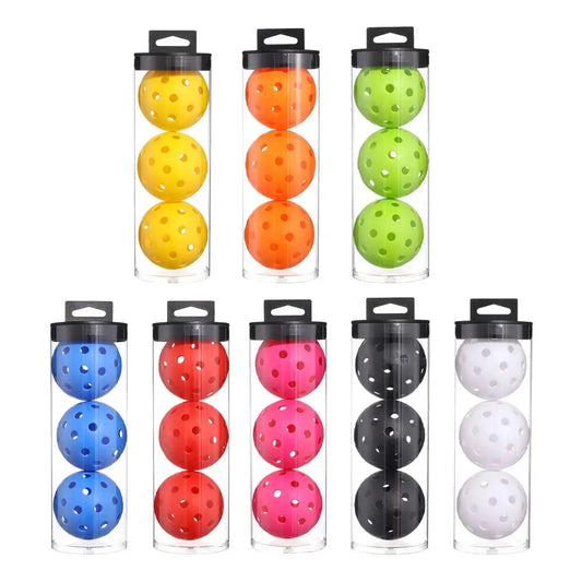 Three Zenn Organics Inc pickleball practice balls with 40 holes, designed for outdoor courts, training, and tournament play.