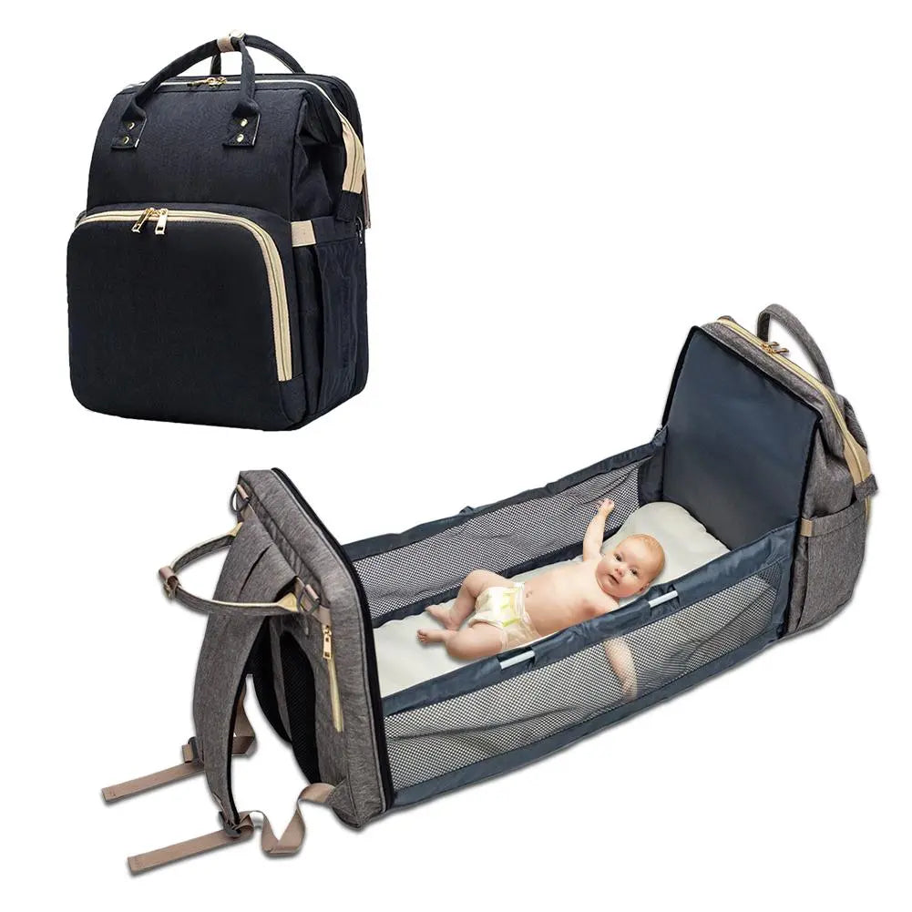 Baby Essentials-4 diaper bag with USB port and sleeping crib, shown with multiple compartments and adjustable straps for parents and babies.