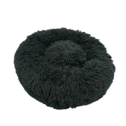 Pet Essentials-11 Calming Donut Bed for dogs and cats, soft cushioned round pet bed with raised edges for comfort and relaxation.