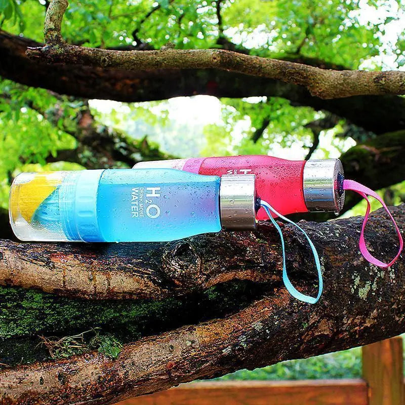 Fitness-6 H₂O Fruit Infuser Water Bottle with colorful fruit infuser and clear plastic body for fresh flavored hydration.