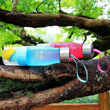 Fitness-6 H₂O Fruit Infuser Water Bottle with colorful fruit infuser and clear plastic body for fresh flavored hydration.