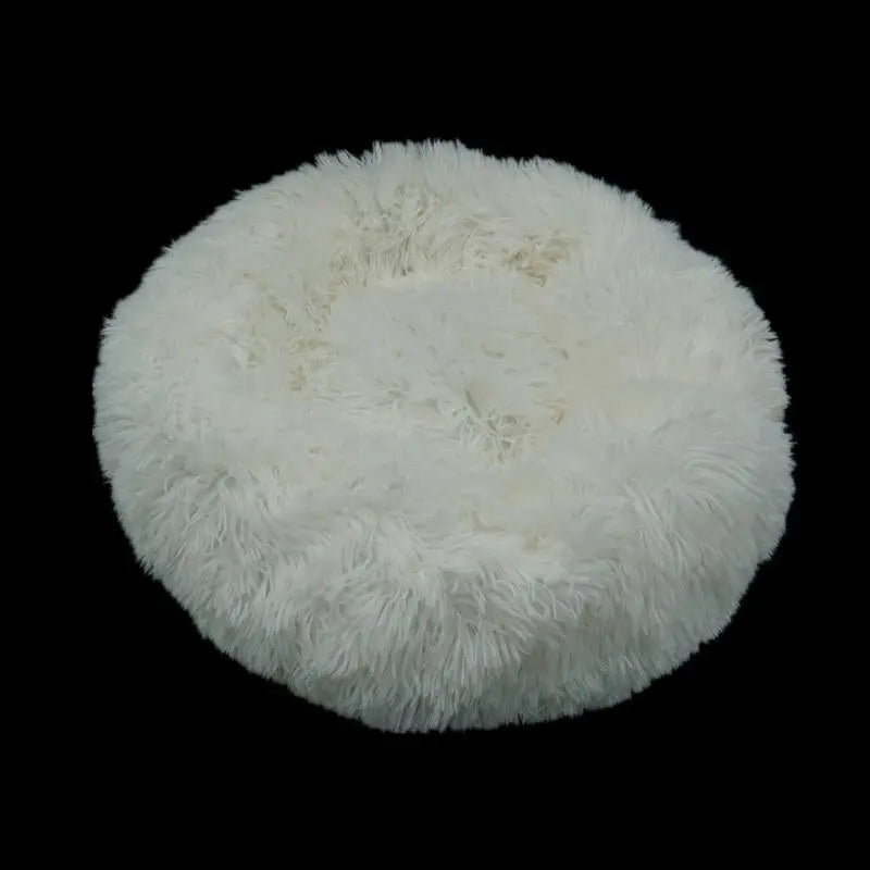 Pet Essentials-11 calming donut bed for dogs and cats, soft round pet bed with cushioned edges for comfort and relaxation.