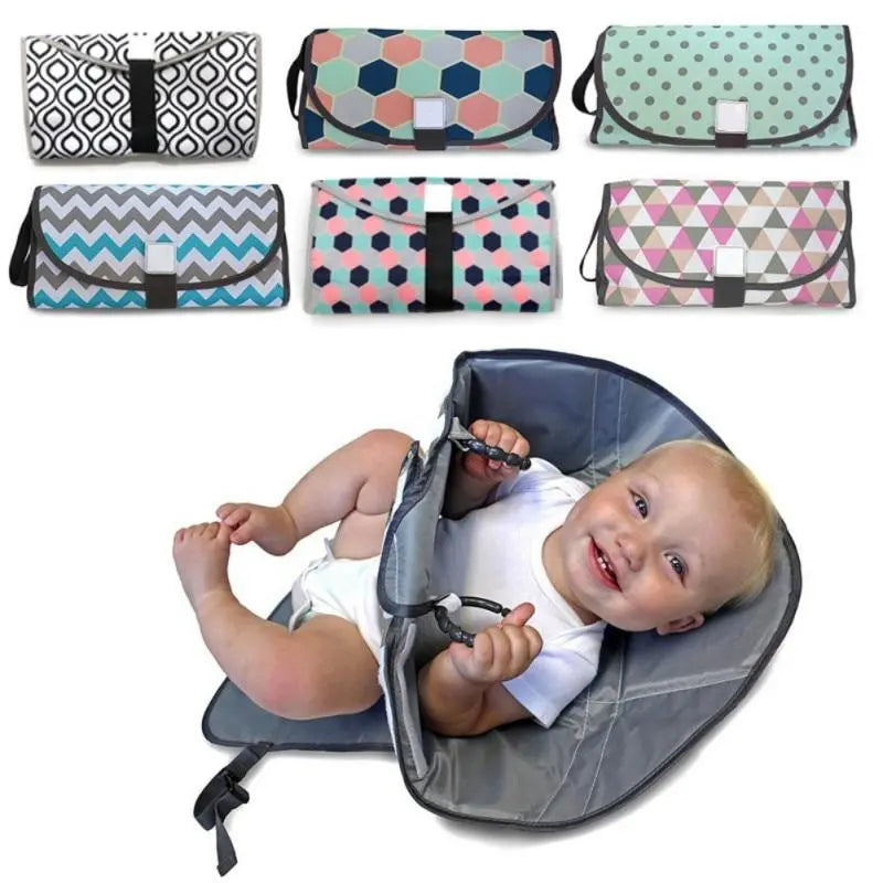 Baby Essentials-4 3-in-1 foldable diaper bag with built-in crib, showing the compact bag with changing pad and storage compartments.